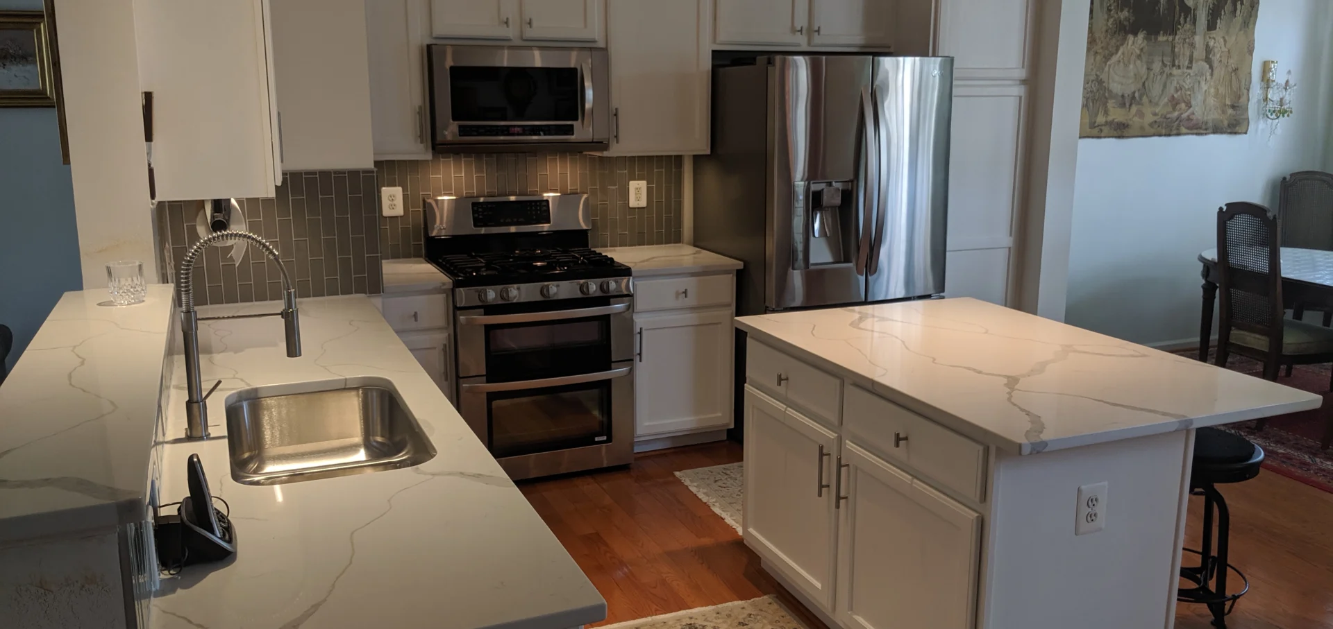 Modern kitchen with stainless steel appliances.